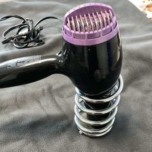 Metal wall mount holder for blow dryer or curling iron.